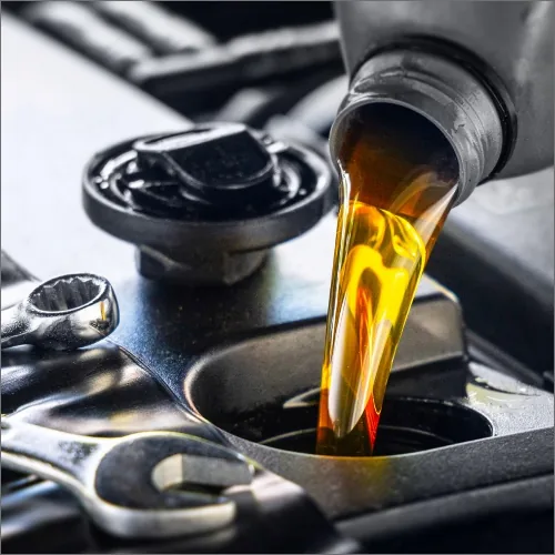 Engine oil being poured into European car engine at Brisbane service workshop