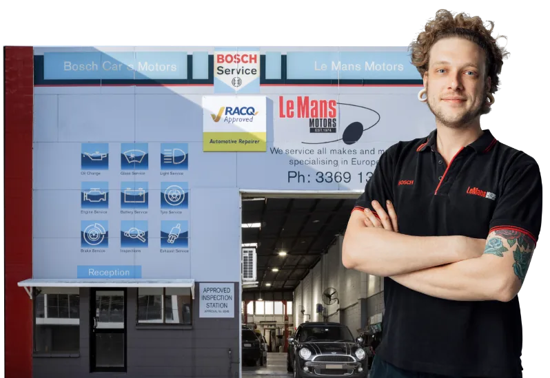 Professional European car mechanic at Bosch Service Brisbane workshop with crossed arms